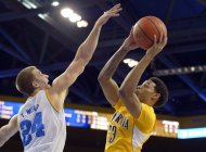California guard Allen Crabbe, right, puts up a shot as UCLA forward Travis Wear defends during the first half of their NCAA basketball game, Thursday, Jan. 3, 2013, in Los Angeles. (AP Photo/Mark J. Terrill)