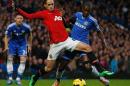 Manchester United's Belgian midfielder Adnan Januzaj (C) battles with Chelsea's Brazilian midfielder Ramires (R) during the English Premier League football match between Chelsea and Manchester United at Stamford Bridge on January 19, 2014