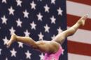 Simone Biles flips on the balance beam during the American Cup gymnastics competition Saturday, March 7, 2015, in Arlington, Texas. Biles led from the start in a record-setting win at the American Cup in her first competition since taking a second straight world all-around title last year. (AP Photo/LM Otero)