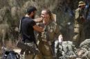 Israeli soldiers from the Givati brigade embrace after returning to Israel from Gaza