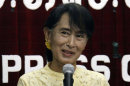 Myanmar opposition leader Aung San Suu Kyi talks to journalists during a press conference at the headquarters of her National League for Democracy Party in Yangon, Myanmar Tuesday, July 3, 2012. (AP Photo/Khin Maung Win)