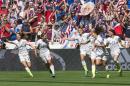 United States teammates, from left to right, Morgan Brian (14), Tobin Heath (17), Alex Morgan (13), Lauren Holiday (12), Carli Lloyd (10) and Ali Krieger (11) celebrate after Lloyd's second goal against Japan during the first half of the FIFA Women's World Cup soccer championship in Vancouver, British Columbia, Canada, on Sunday, July 5, 2015. (Jonathan Hayward/The Canadian Press via AP) MANDATORY CREDIT