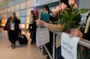 Opponents of U.S. President Donald Trump's executive order travel ban greet international travelers at Logan Airport in Boston