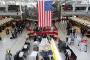 People wait in a security line at John F. Kennedy Airport on February 28, 2013 in New York City