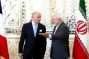 French foreign minister Laurent Fabius and his Iranian counterpart Mohammad Javad Zarif arrive for a meeting in Tehran