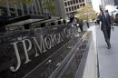 A man walks past JPMorgan Chase & Co's international headquarters on Park Avenue in New York