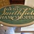 A sign advertising Smithfield hams hangs at the Taste of Smithfield restaurant and gourmet market in Smithfield, Virginia