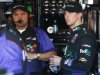 Denny Hamlin, right, meets with crew chief Darian Grubb in the team garage during practice for the NASCAR Sprint Cup Series auto race Saturday, March 2, 2013, in Avondale, Ariz.(AP Photo/Ross D. Franklin)