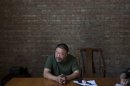 Artist Ai Weiwei speaks to journalists at his studio in Beijing, China, Wednesday, May 22, 2013. Ai's music video accompanying his heavy metal single 