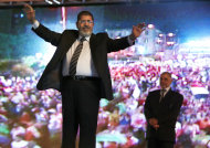 FILE - In this Sunday, May 20, 2012 file photo, the Muslim Brotherhood's presidential candidate Mohammed Morsi hold a rally in Cairo, Egypt. Egypt's electoral commission announced Sunday, June 24, 2012 that Morsi is victor of landmark presidential vote.(AP Photo/Fredrik Persson, File)