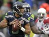 Seattle Seahawks quarterback Russell Wilson (3) passes against the Arizona Cardinals during the first half of an NFL football game in Seattle, Sunday, Dec. 9, 2012. (AP Photo/Stephen Brashear)