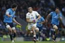 England's Jonathan Joseph, centre, races with the ball on his way to scoring a try during the Six Nations international rugby union match against Italy at Twickenham stadium in London, Saturday, Feb. 14, 2015. (AP Photo/Alastair Grant)