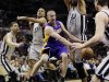 Los Angeles Lakers' Steve Blake, center, is surrounded by San Antonio Spurs', from left, Danny Green, Tony Parker, Tim Duncan and Tiago Splitter as he tries to drive to the basket during the first half of Game 1 of their first-round NBA playoff basketball series, Sunday, April 21, 2013, in San Antonio. (AP Photo/Eric Gay)