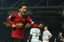 Manchester United's Ander Herrera celebrates after scoring the opening goal during their English FA Cup third round soccer match between Yeovil Town and Manchester United at Huish Park stadium in Yeovil, England, Sunday, Jan. 4, 2015 . (AP Photo/Alastair Grant)