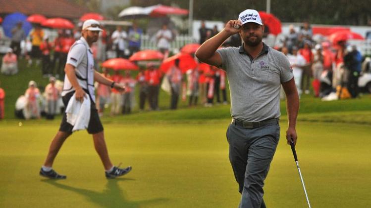 Ryan Moore celebrates after making a putt on the 18th green during the final round of the CIMB Classic in Kuala Lumpur on October 27, 2013