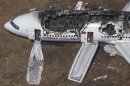 File picture shows an aerial view of an Asiana Airlines Boeing 777 plane after it crashed while landing at San Francisco International Airport in California