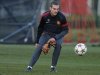 Manchester United's Vidic stretches for a ball during a training session at the club's Carrington training complex in Manchester
