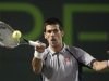 Serbia's Novak Djokovic returns a shot to Germany's Tommy Haas in their men's singles fourth round match at the Sony Open tennis tournament in Key Biscayne, Florida
