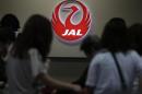 A logo of Japan Airlines is seen at passengers' check-in counter at Haneda airport in Tokyo