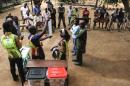 Electoral officials start the counting operations at a polling station in Lagos, on March 29, 2015