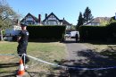 The home of Saad al-Hilli, in Claygate, England, who was shot dead on Wednesday with three others while vacationing in the French Alps, continues to be guarded by Surrey Police, who are assisting French police, Sunday, Sept. 9, 2012. The children of the al-Hilli family survived the killing, as 4-year-old daughter Zeena stayed hidden below the body of her dead mother, and 7-year-old Zaina who was shot in the shoulder and beaten. (AP Photo/Steve Parsons,PA) UNITED KINGDOM OUT - NO SALES - NO ARCHIVES