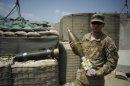 Sergeant George Araujo of the US Army holds a mortar round at the Forward Operating Base Joyce in the Kunar province