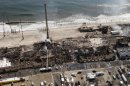This aerial photo shows aftermath of a massive fire that burned a large portion of the Seaside Park boardwalk, Friday, Sept. 13, 2013, in Seaside Park, N.J. The fire, which apparently started Thursday in an ice cream shop and spread several blocks, hit the recently repaired boardwalk, which was damaged last year by Superstorm Sandy. (AP Photo/The Asbury Park Press, Bob Bielk)
