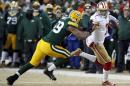 San Francisco 49ers quarterback Colin Kaepernick (7) runs against Green Bay Packers inside linebacker Brad Jones (59) during the first half of an NFL wild-card playoff football game, Sunday, Jan. 5, 2014, in Green Bay, Wis. (AP Photo/Mike Roemer)