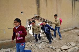 File picture shows pupils running through a damaged&nbsp;&hellip;