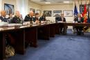 President Barack Obama, right, sits next to Defense Secretary Ash Carter, with other military personnel as they wait to receives an update on the Islamic State group at the Pentagon on Monday, July 6, 2015. (AP Photo/Jacquelyn Martin)