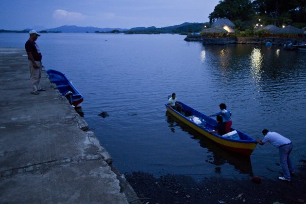 In this June 7, 2013 photo, people push a boat into Lake Nicaragua, near Granada, Nicaragua. A multi-billion dollar Chinese plan to plow a massive rival to the Panama Canal across the middle of Nicaragua was headed for approval by the leftist-controlled National Assembly Thursday, June 13, 2013, capping a lightning-fast approval process that has provoked deep skepticism among shipping experts and intense concern among environmentalists. (AP Photo/Esteban Felix)