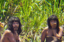 FILE - This Nov. 2011 file photo, shows members of the Mashco-Piro tribe, photographed at an undisclosed location near the Manu National Park in southeastern Peru. More than 100 Mashco-Piro appeared across a river from the remote community of Monte Salvado in Madre de Dios state, says Klaus Quicque the president of the regional FENAMAD indigenous federation on Monday, Aug. 19, 2013. The Maschco-Piro first appeared in May 2011 after more than two decades in voluntary isolation. (AP Photo/Diego Cortijo, Survival International, File)