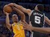San Antonio Spurs guard Cory Joseph, right, blocks a shot by Los Angeles Lakers guard Andrew Goudelock during the second half in Game 3 of a first-round NBA basketball playoff series, Friday, April 26, 2013, in Los Angeles. (AP Photo/Mark J. Terrill)