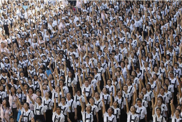 Thousands of students and faculty members dance to the theme song of the One Billion Rising global campaign in the quadrangle of the St. Scholastica college in Manila