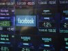 The Facebook logo appears on a display inside the NASDAQ Marketsite in Times Square Thursday, May 17, 2012, in New York. Facebook priced its IPO at $38 per share on Thursday, at the high end of its expected range. If extra shares reserved to cover additional demand are sold as part of the transaction, Facebook Inc. and its early investors stand to reap as much as $18.4 billion from the IPO. (AP Photo/Frank Franklin II)