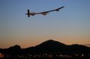 FILE - This May 22, 2013 file photo shows the Solar Impulse, piloted by André Borschberg, taking flight, at dawn, from Sky Harbor International Airport in Phoenix. The spindly no-fuel plane called Solar Impulse is scheduled to leave Washington Saturday early in the morning and arrive after midnight at New York's John F. Kennedy International Airport. It may silently buzz the Statue of Liberty on the way. The plane started its cross-country journey May 3 from San Francisco. (AP Photo/Matt York)