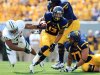 West Virginia running back Andrew Buie (13) breaks a tackle by Baylor's Terrance Lloyd (11) during their NCAA college football game in Morgantown, W.Va., Saturday, Sept. 29, 2012. No. 9 West Virginia beat No. 25 Baylor  70-63.  (AP Photo/Christopher Jackson)