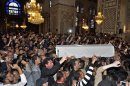 In this photo released by the Syrian official news agency SANA, mourners carry the body of Sheik Mohammad Said Ramadan al-Buti, an 84-year-old pro-government cleric during his funeral in the eighth century Omayyad Mosque, in Damascus, Syria, Saturday, March 23, 2013. Al-Buti, his grandson and scores of others were killed Thursday, March 21, 2013 when a suicide bomber detonated his explosives inside a mosque where al-Buti was giving a religious lesson. His assassination was a blow to Assad, who vowed Friday to avenge his death. (AP Photo/SANA)