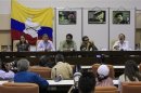 FARC negotiator Paris talks to the media next to members of the FARC rebel group Santrich, Tellez, Nijmeijer of the Netherlands and lead negotiator Marquez during a news conference in Havana