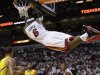 Miami Heat forward LeBron James (6) hangs from the basket after dunking the ball during the second half of Game 2 in their NBA basketball Eastern Conference finals playoff series against the Indiana Pacers, Friday, May 24, 2013, in Miami. (AP Photo/Lynne Sladky)