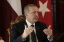 Turkey's President Erdogan speaks during a news conference in Riga