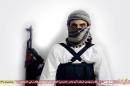 This image taken from a militant website associated with Islamic State extremists, posted Saturday, May 23, 2015, purports to show a suicide bomber identified as a Saudi citizen with the nom de guerre Abu Amer al-Najdi who carried out an attack on a Shiite mosque. The Islamic State group's radio station has claimed responsibility for that suicide bombing Friday, warning that more "black days" loom ahead for Shiites. The attack killed at least 21 people and wounded dozens in the village of al-Qudeeh in the eastern Qatif region as worshippers commemorated the birth of a revered saint. The Arabic bar below reads: "Urgent: The heroic martyr Abu Amer al-Najdi, the attacker of the (Shiite) temple in Qatif." (Militant photo via AP)