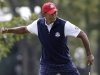 USA's Tiger Woods reacts after making a putt on the first hole during a four-ball match at the Ryder Cup PGA golf tournament Friday, Sept. 28, 2012, at the Medinah Country Club in Medinah, Ill. (AP Photo/Chris Carlson)