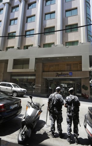 Lebanese policemen stand guard outside a hotel where …