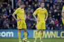 Liverpool's captain Steven Gerrard, left, and Rickie Lambert stand with their hands on their hips during the English Premier League soccer match between Crystal Palace and Liverpool at Selhurst Park stadium in London, Sunday, Nov. 23, 2014. (AP Photo/Matt Dunham)