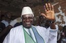 Sierra Leone's incumbent President Ernest Bai Koroma waves to supporters after voting in the capital Freetown