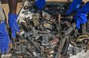 Broken weapons are sorted through at the United Nations Missions in South Sudan (UNMISS) base in Juba after they were broken up to prevent their future use