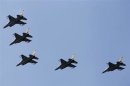 Israeli Air Force F-16 war planes fly in formation over the Mediterranean Sea as part of celebrations for Israel's 65th Independence Day