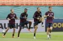 England players Wayne Rooney, left, Daniel Sturridge, second from left, Rickie Lambert, second from right, and Gary Cahill, right, warm up during practice, Tuesday, June 3, 2014 in Miami Gardens, Fla. England plays matches at Sun Life Stadium, against Ecuador on Wednesday and Honduras on Saturday. (AP Photo/Wilfredo Lee)