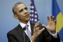 President Barack Obama gestures as he answers questions during a joint news conference with Swedish Prime Minister Fredrik Reinfeldt, Wednesday, Sept. 4, 2013, at the Rosenbad Building in Stockholm, Sweden. (AP Photo/Pablo Martinez Monsivais)